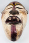 Reverse view of a hollowed African wooden mask with visible hand-tool marks