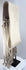 Side view of a long Hopi-style cotton sash showing its sculptural tassel arrangement