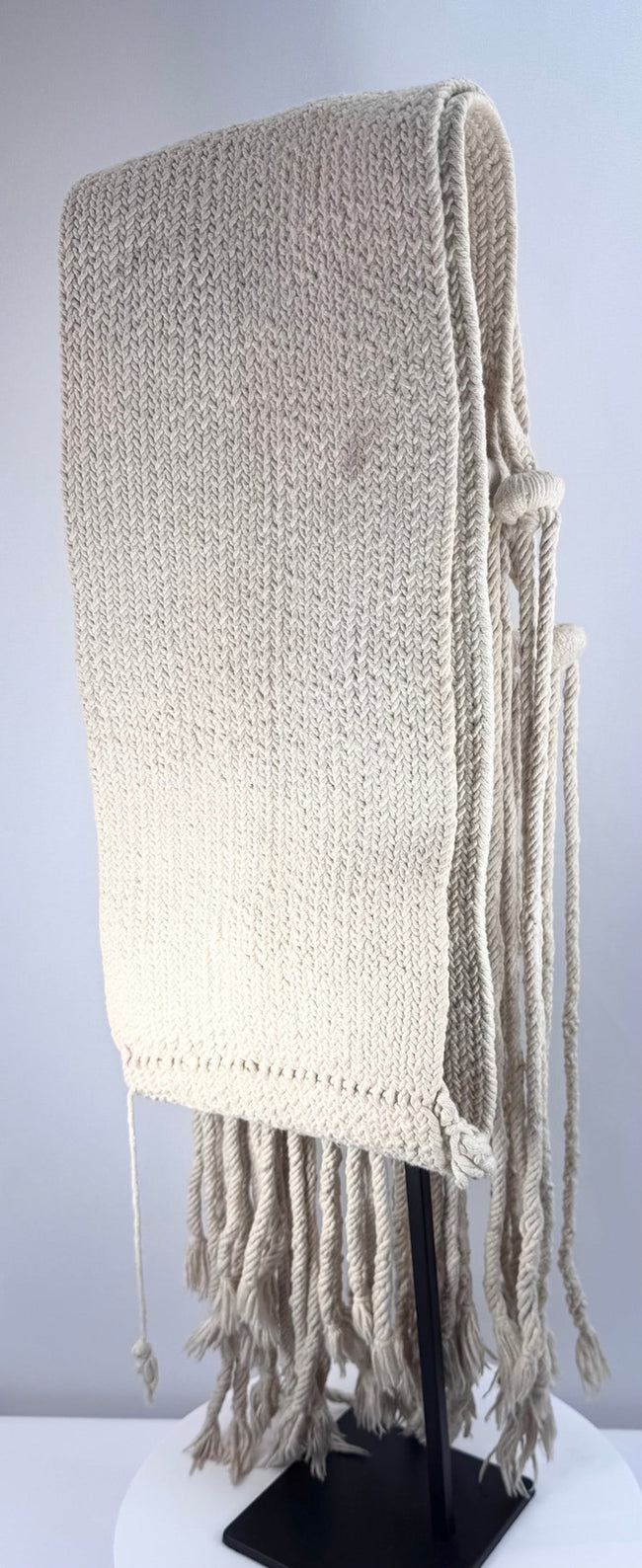Full view of a handwoven Pueblo cotton sash measuring approximately 52 inches long