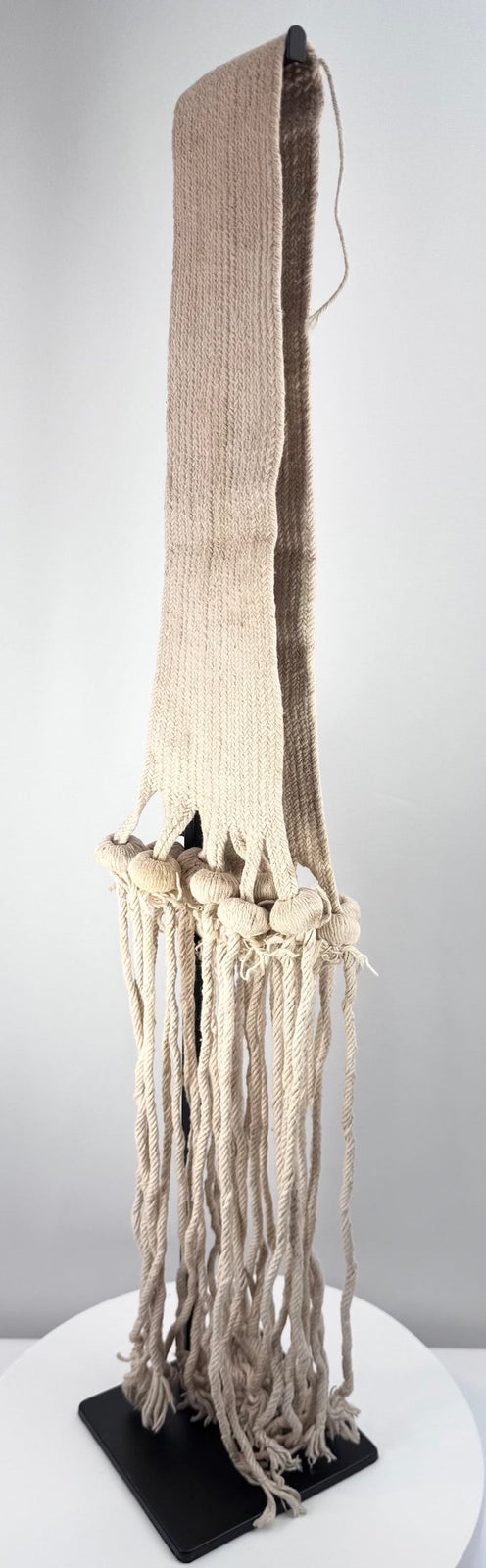 Antique Hopi-style ceremonial textile with twisted cords and rounded tassel forms