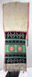 Detailed view of stepped and diamond embroidery on a Pueblo ceremonial sash