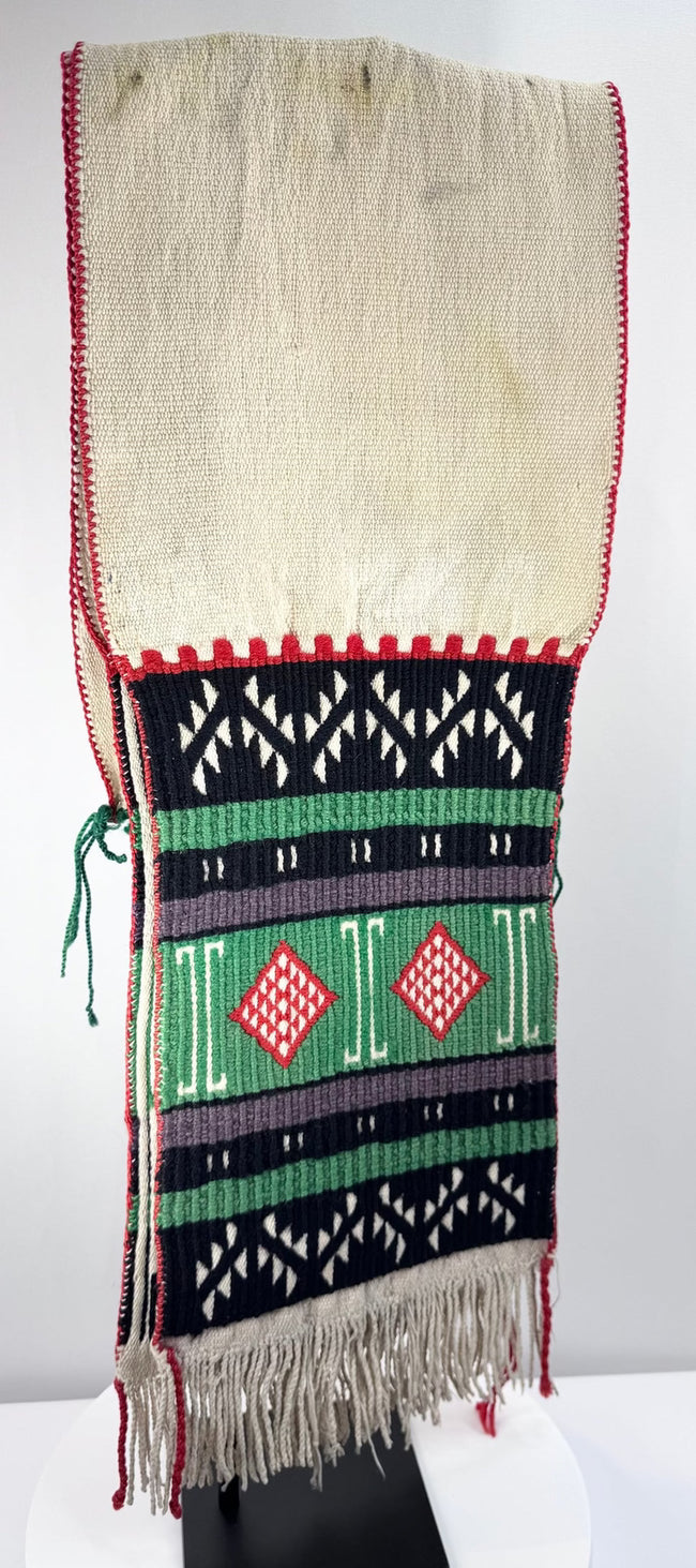 Antique Hopi-attributed textile with bold black pattern bands and red stitched edging