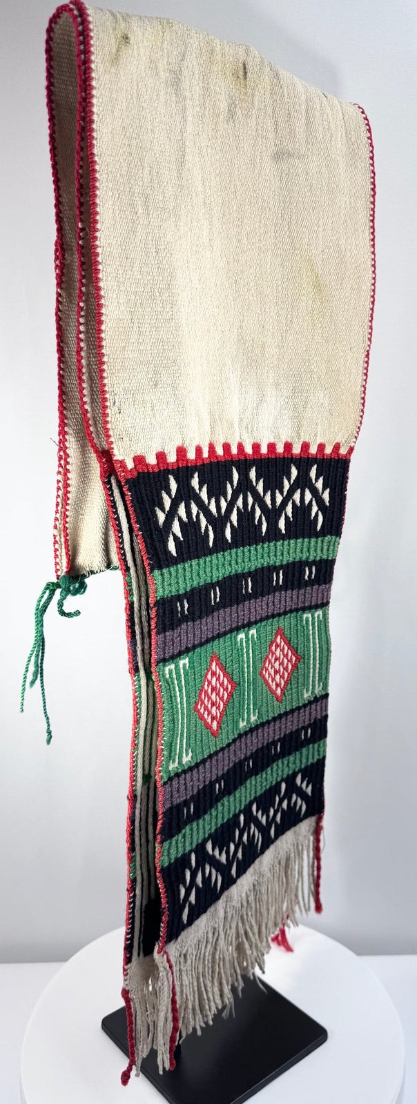 Close view of the hand-tied fringe on a mid-century Southwestern ceremonial textile