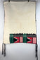 Detail of colourful Germantown wool embroidery on a cream-coloured Hopi-style dance kilt