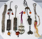 Group of six antique Chinese garment ornaments and amulets dating to the late Qing and early Republic periods