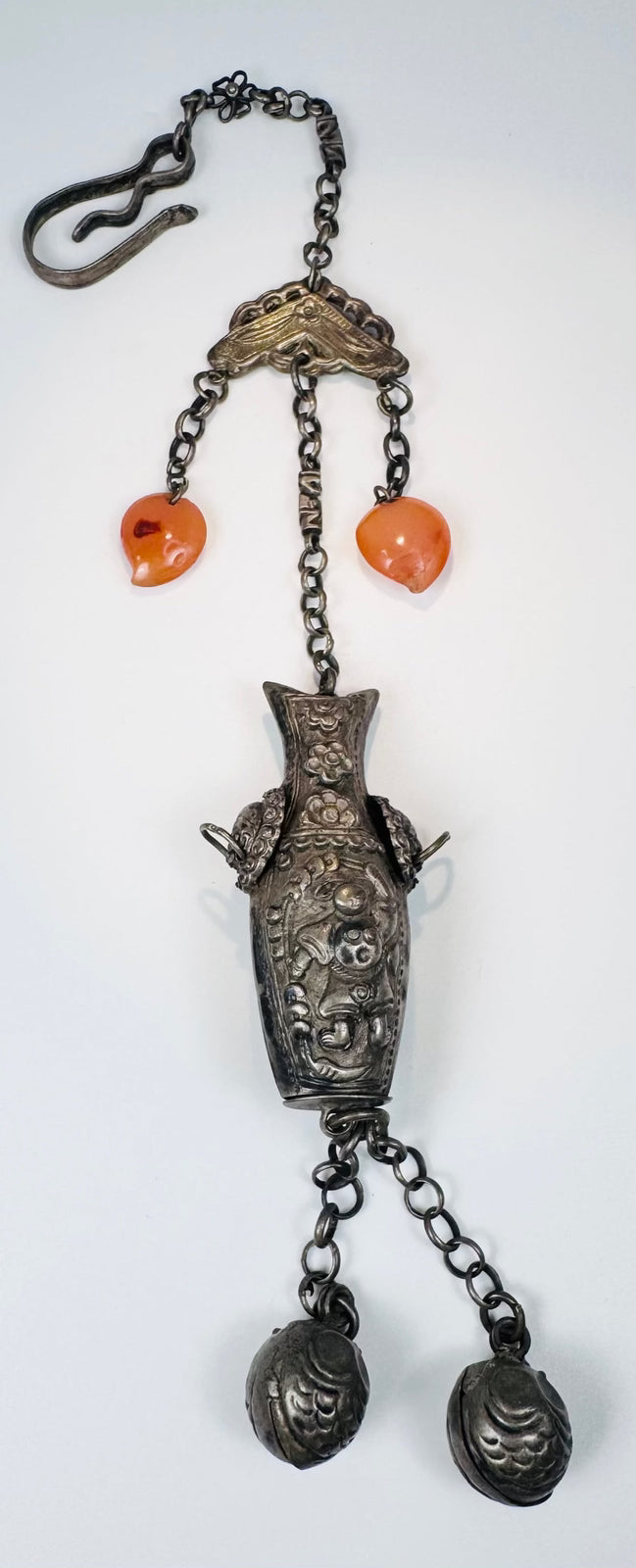 Late Qing Chinese vessel-form chatelaine with orange beads, repoussé decoration and paired spherical bells