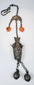 Late Qing Chinese vessel-form chatelaine with orange beads, repoussé decoration and paired spherical bells