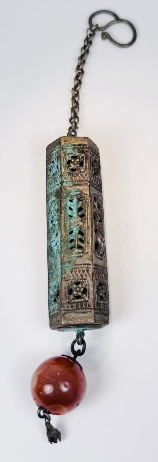 Pierced multi-sided Chinese silver-alloy amulet case with S-shaped hook and translucent red-orange terminal bead