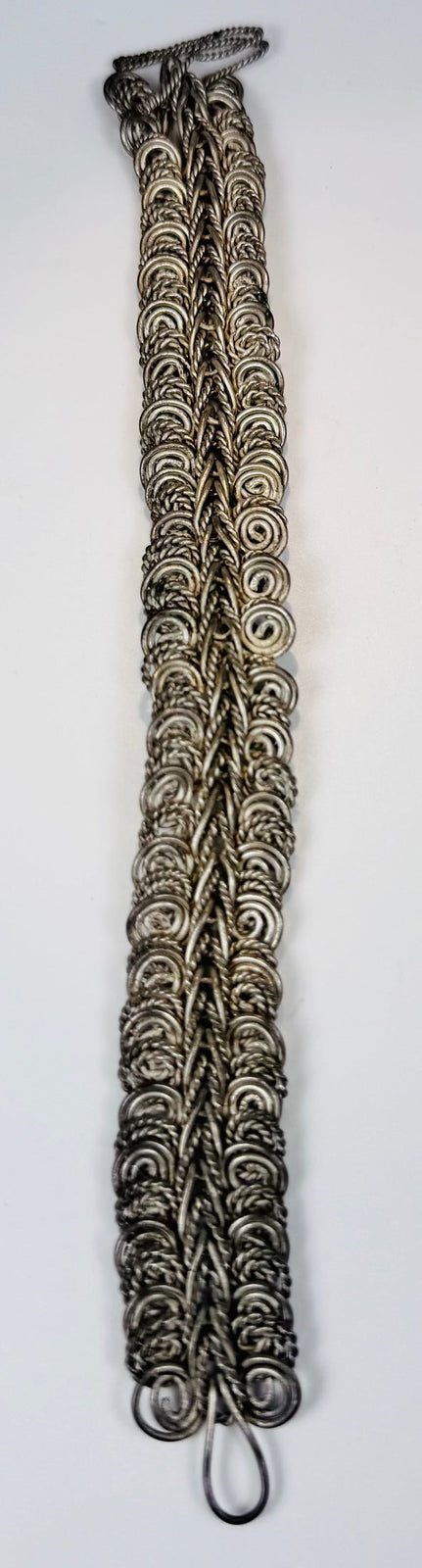 Antique Chinese looped wire chain ornament with dense herringbone-patterned silver-colored metalwork