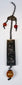 Late Qing Chinese rectangular figural chatelaine pendant with relief decoration and orange-red beads