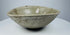 Early Vietnamese ceramic bowl with original kiln irregularities and jade-like colouring
