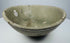 Detail of the gray-green celadon glaze and concentric throwing lines inside the bowl