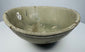 Detail of the gray-green celadon glaze and concentric throwing lines inside the bowl