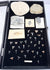 Full overhead view of a fossil collection containing trilobites, shark teeth, fossil fish and sedimentary stone