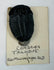 Large individual Cambrian trilobite mounted on a handwritten vintage identification card