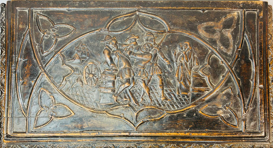 Hand-carved Renaissance Italian forziere with deeply carved figures, scrollwork, and decorative relief panels