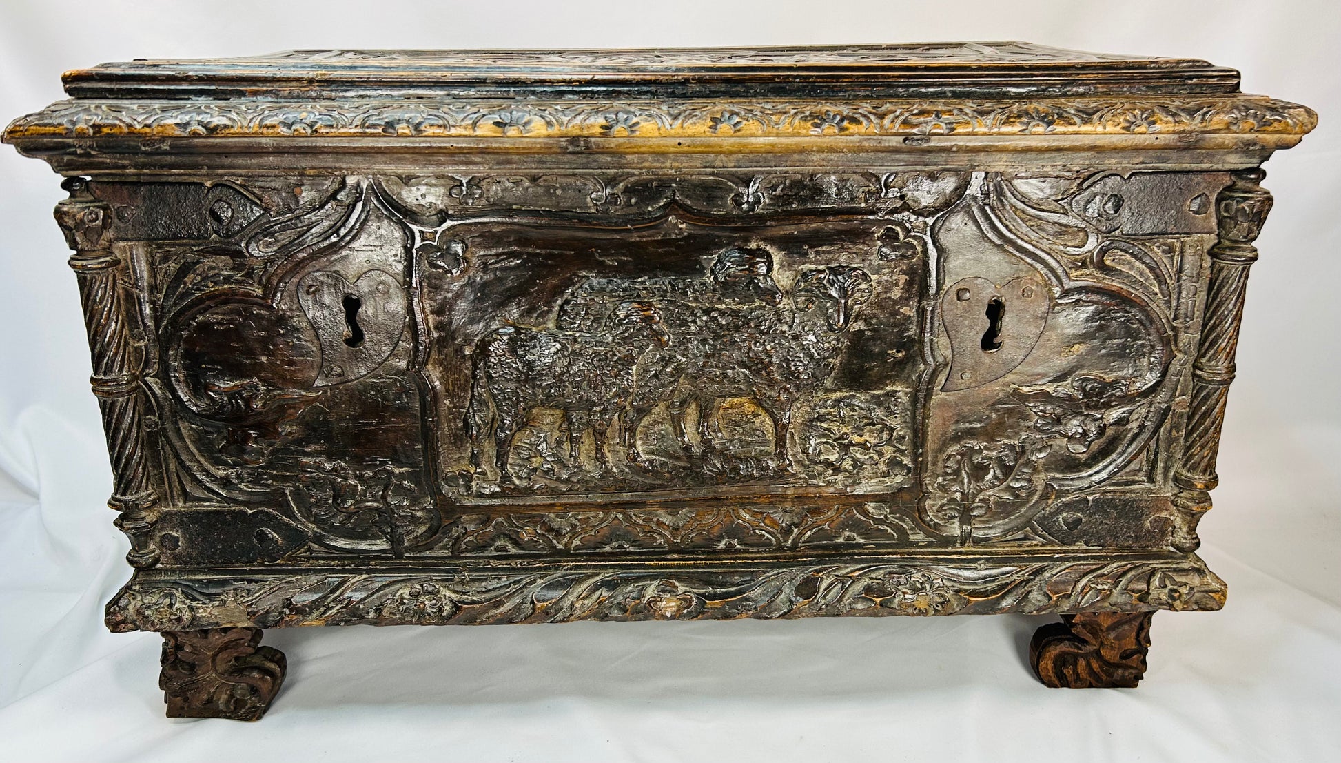 Early Baroque / late Renaissance Italian cassone chest with pastoral scenes and ornate carved detailing