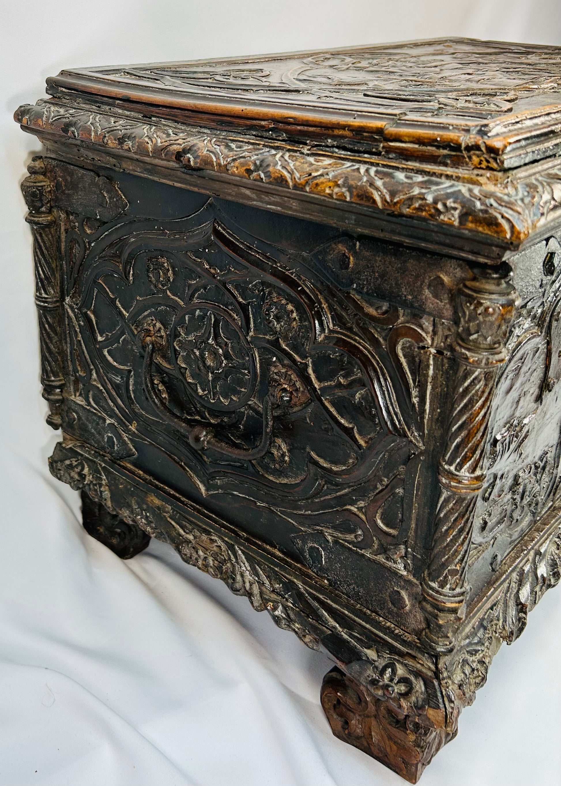 Historic Renaissance marriage chest with figural carvings, foliate borders, and original patina