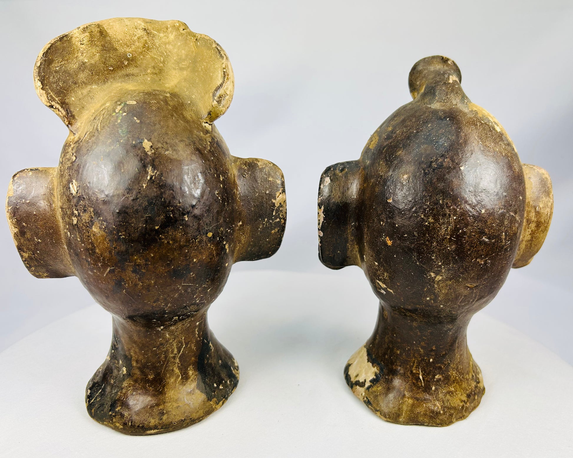 Twentieth-century terracotta head pair with Pre-Columbian style influence and sculptural presence