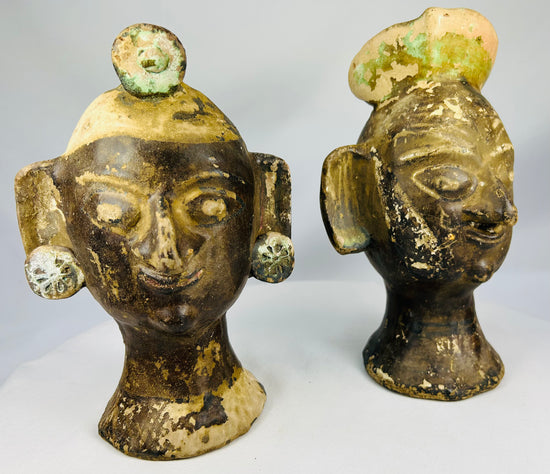 Stylized terracotta portrait heads from Mexico or Central America with bold sculptural design