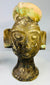 Decorative terracotta ceremonial heads with rounded headdress knops and strong visual symmetry