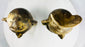 Matched pair of hollow terracotta head figures with expressive features and cultural inspiratio