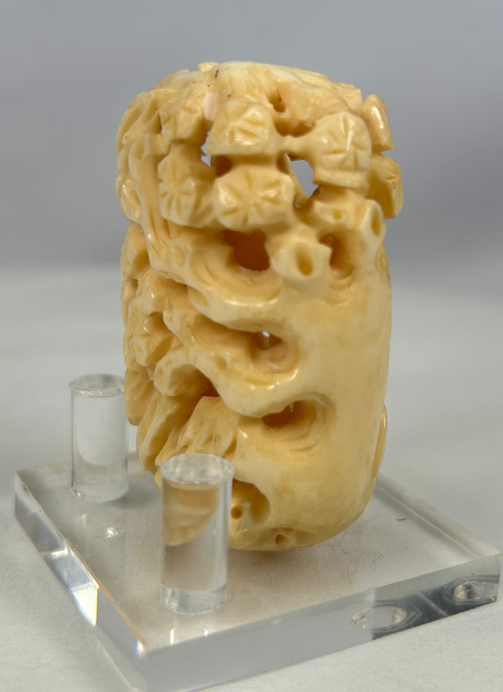 Antique Japanese openwork bone carving with sculpted birds and foliage in high relief