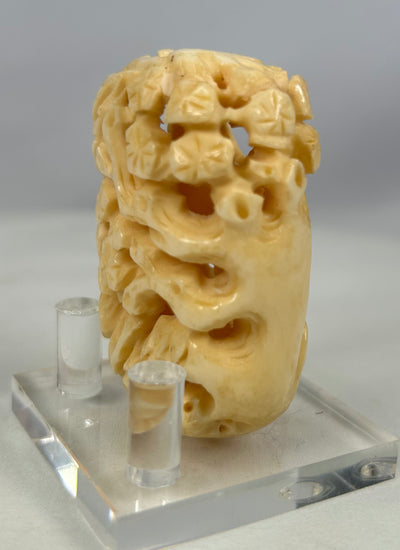 Antique Japanese openwork bone carving with sculpted birds and foliage in high relief