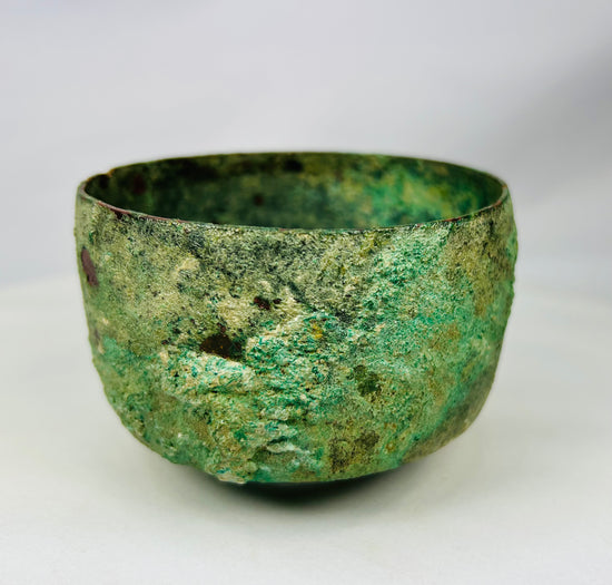 Early Iron Age bronze bowl from Luristan with mineralized archaeological surface