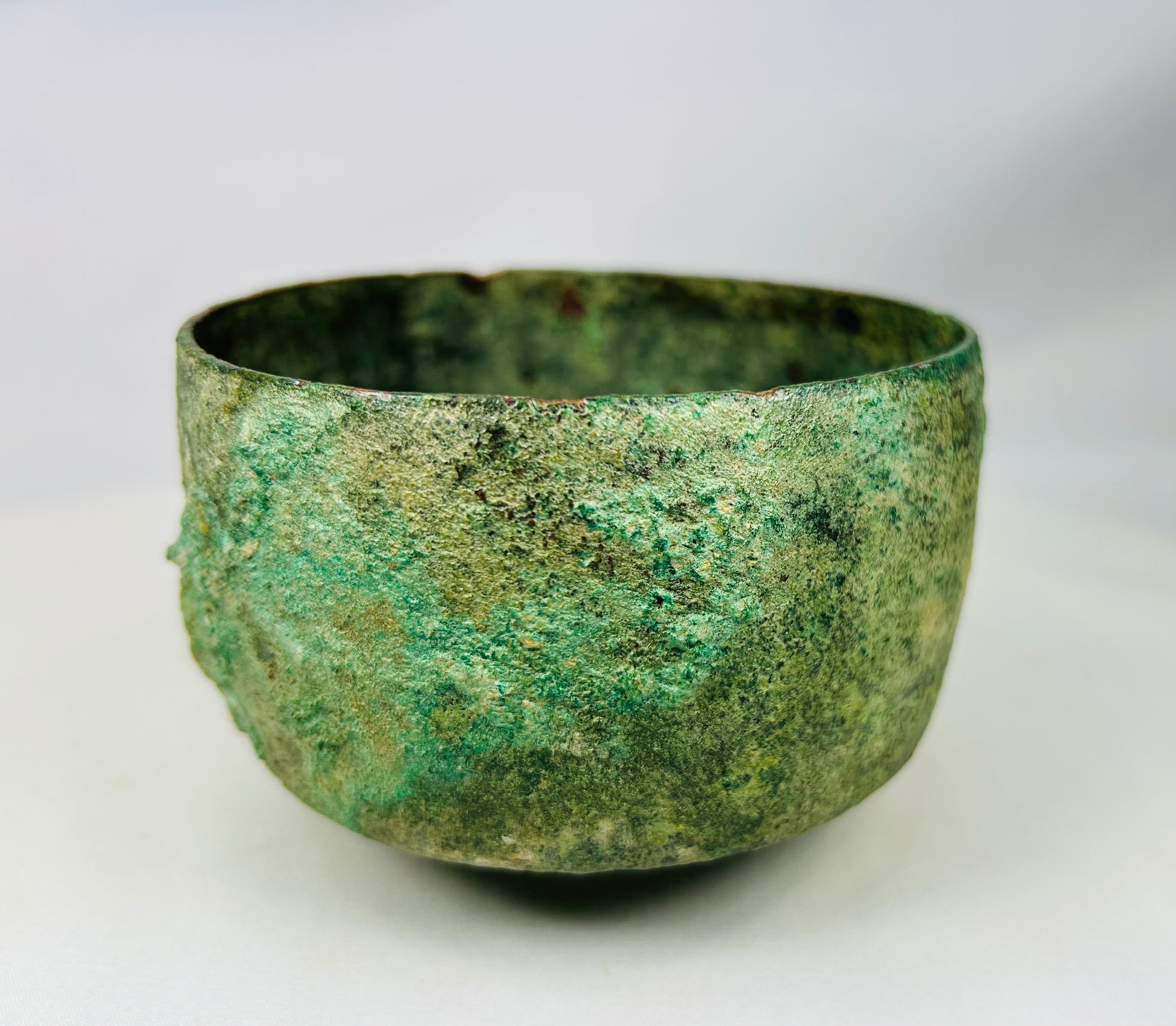Authentic ancient Luristan cast bronze bowl showing green and blue patina encrustation