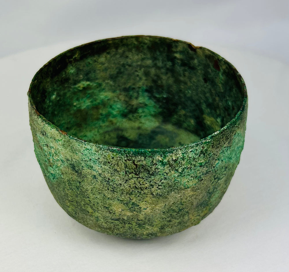 Early Iron Age Near Eastern bronze vessel with variegated green patina and earthen deposits