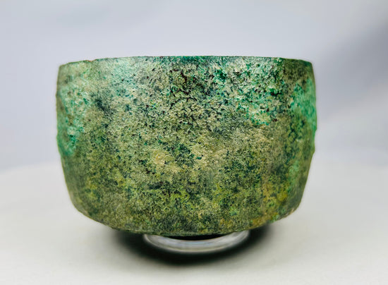 Ancient bronze bowl from Luristan, Iran displaying striking archaeological patina