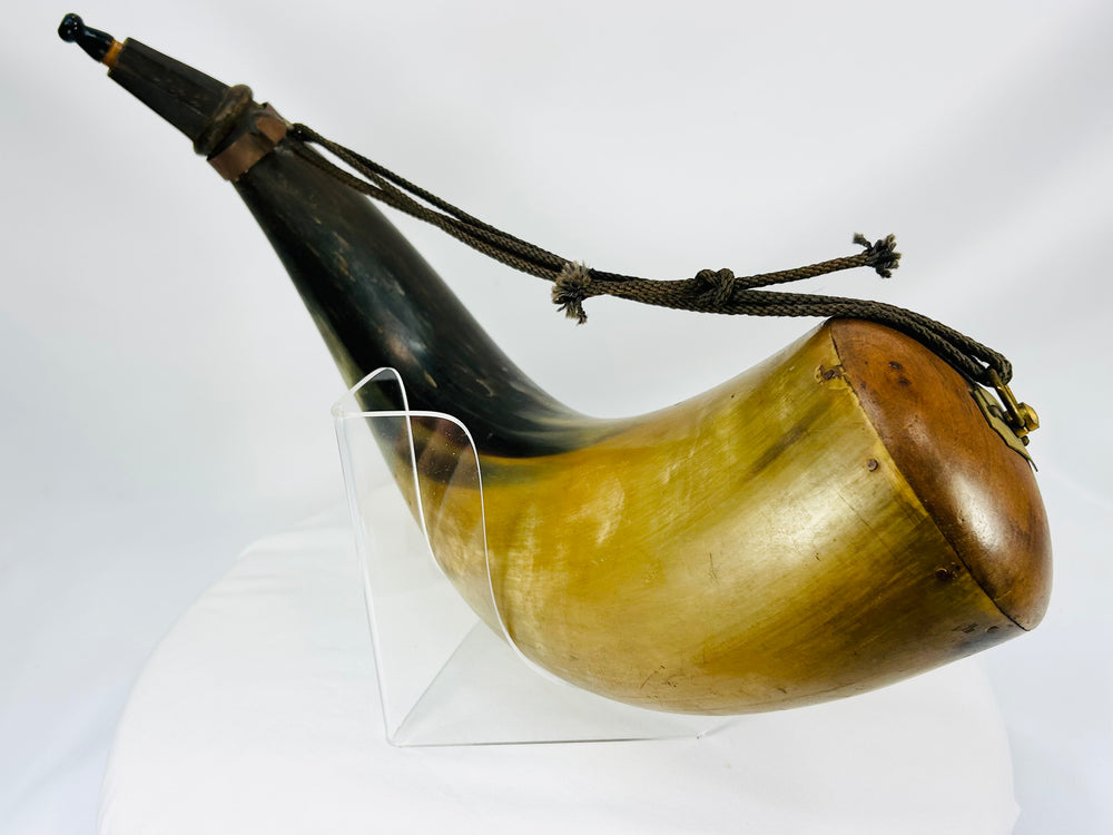 Authentic antique powder horn from circa 1780–1830 with wood, brass, and polished horn