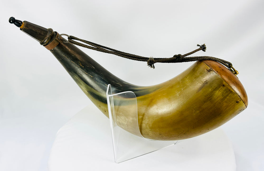 Large display powder horn with natural amber-to-charcoal horn coloration and hand-carved details