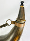 Antique cow horn powder container with brass hardware and woven carrying strap