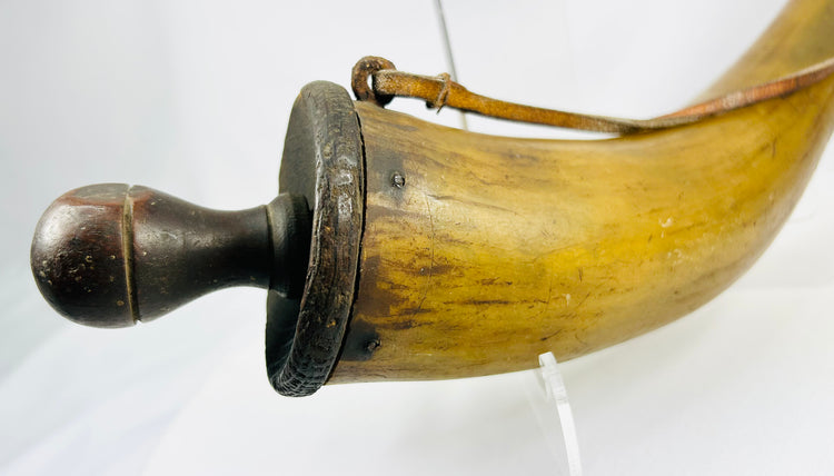 Early North American powder horn with honey-toned polished horn and old inventory label