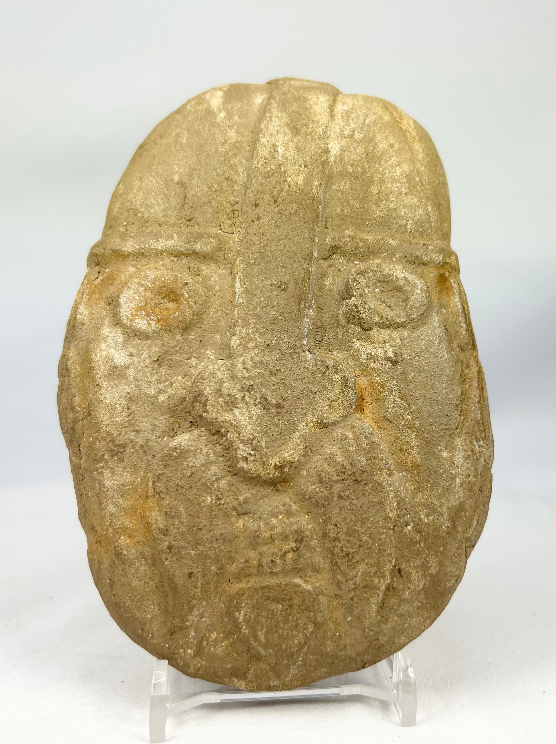 Ancient-style warrior effigy stone carving with primitive expression