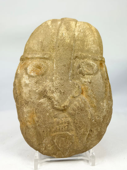 Ancient-style warrior effigy stone carving with primitive expression