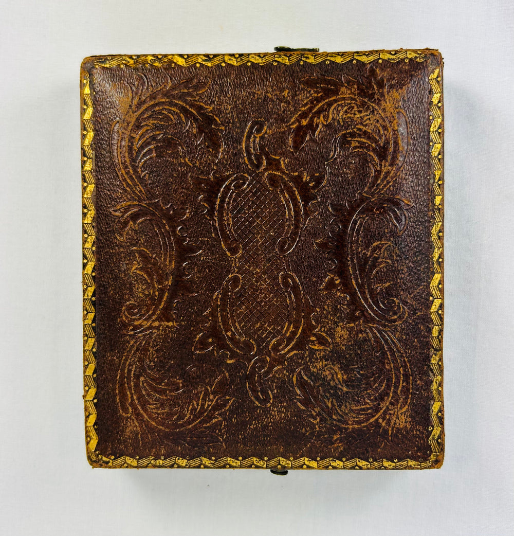 Historic 19th century photographic portrait in decorative leather case with clasp and velvet lining