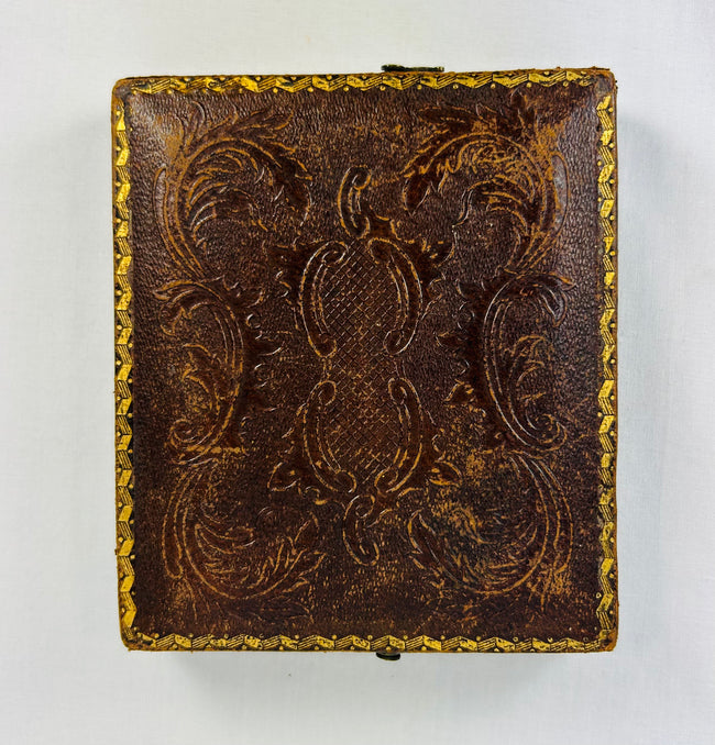 Historic 19th century photographic portrait in decorative leather case with clasp and velvet lining