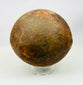 Authentic antique iron cannonball, likely military artillery shot, heavily weathered