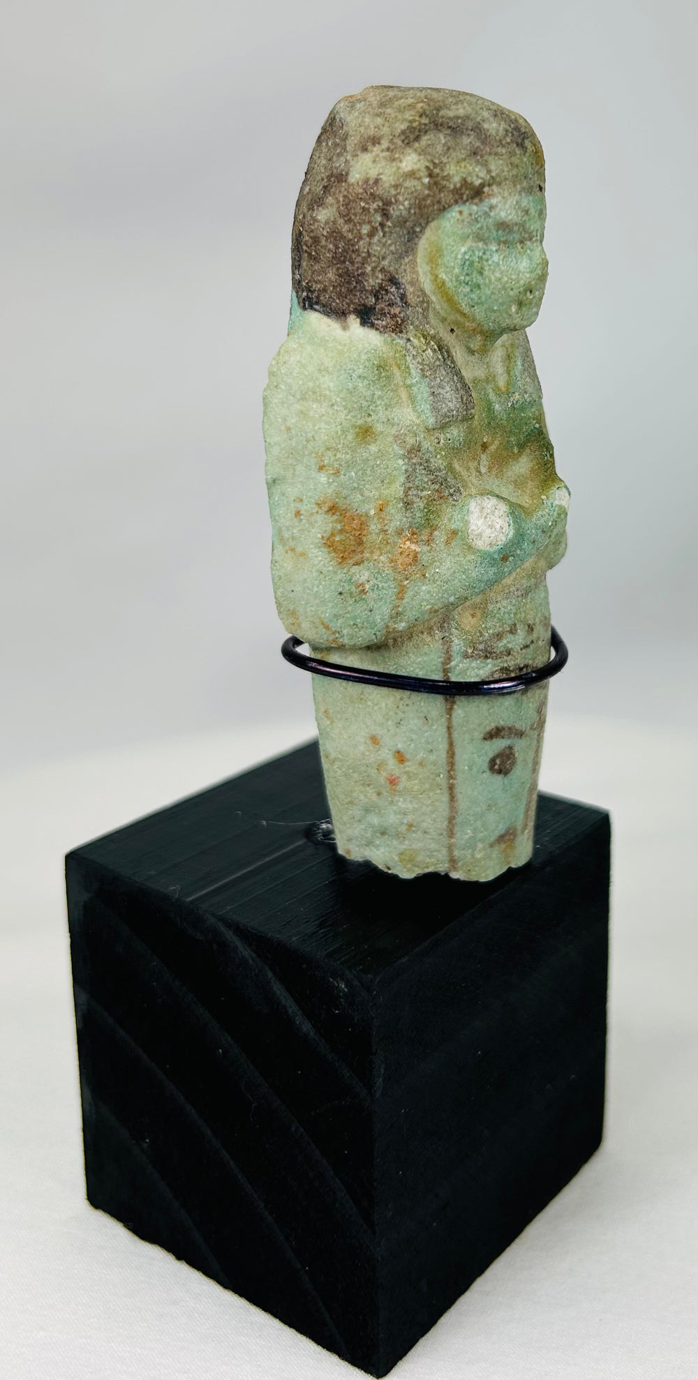 Ancient Egypt ushabti servant figure in mummiform posture, blue-green faience glaze