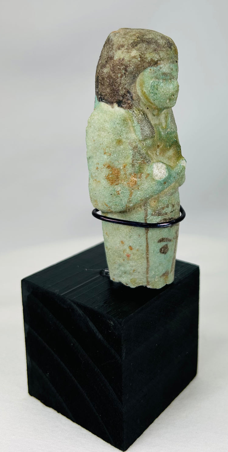Ancient Egypt ushabti servant figure in mummiform posture, blue-green faience glaze