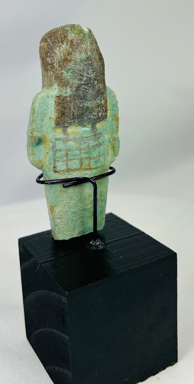 Ancient ushabti figure from Egypt with black painted basket grid and hieroglyphs