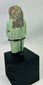 Ancient ushabti figure from Egypt with black painted basket grid and hieroglyphs
