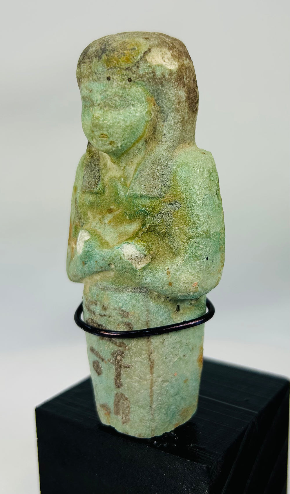 26th Dynasty ushabti with preserved glaze, painted details, and missing lower portion