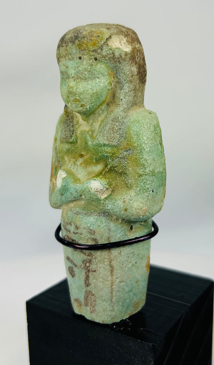 26th Dynasty ushabti with preserved glaze, painted details, and missing lower portion
