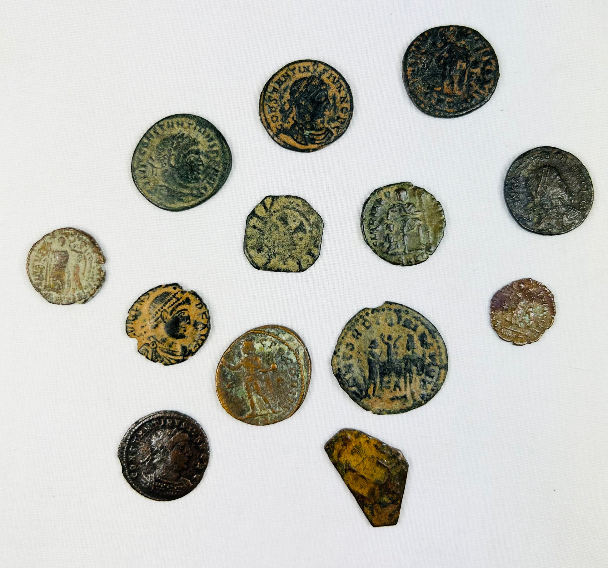 Roman coin reverse with military emblem and heavily patinated bronze surface