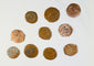Medieval Crusader bronze coins from the Levant displaying crosses, religious motifs, and centuries-old archaeological patination.