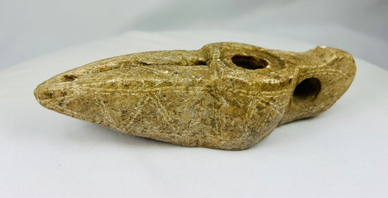 Antique Middle Eastern oil lamp carved from stone with loop handle